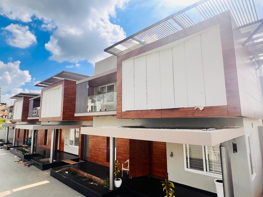 Fundermax cladding - modern residential facade installation Ernakulam Kerala | Precise Homes