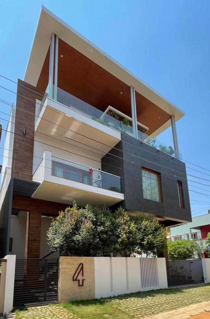 Fundermax gate - gate pillar cladding installation Kochi Kerala | Precise Homes