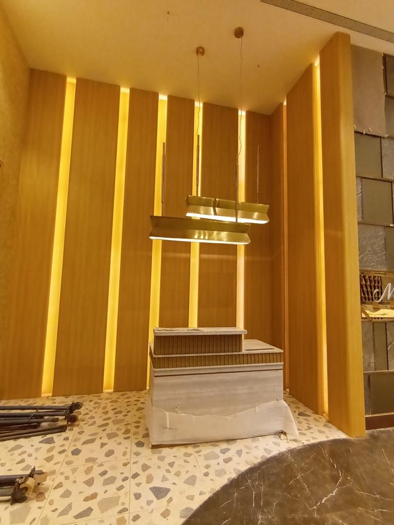 LG Hausys luxury - warm gold interior installation Thrissur Kerala | Precise Homes